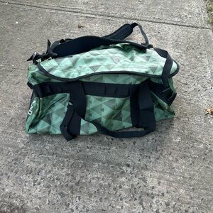 Green and Black Duffel Bag with Cylindrical Shape